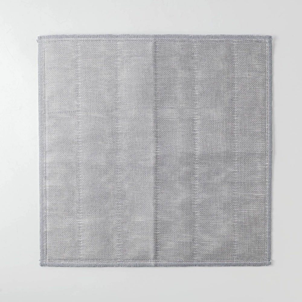 Gray textured rug on a light gray background