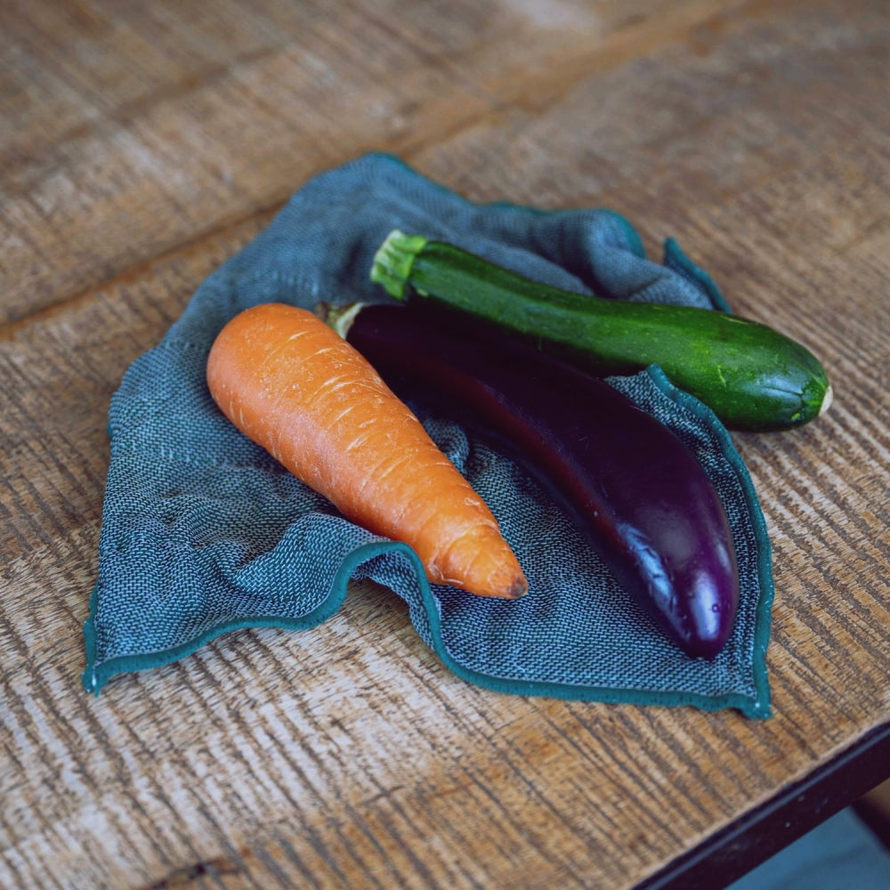 Green Japanese kitchen cloth on a grey background