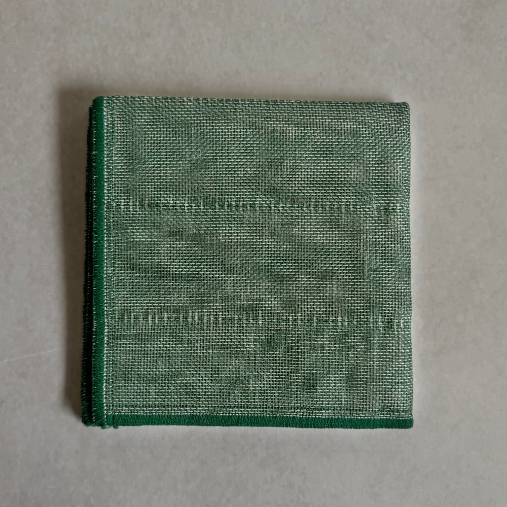 Green Japanese kitchen cloth on a grey background